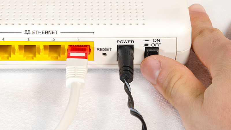 hand-while-connecting-a-router-to-internet-picture-id1338109920-800x450